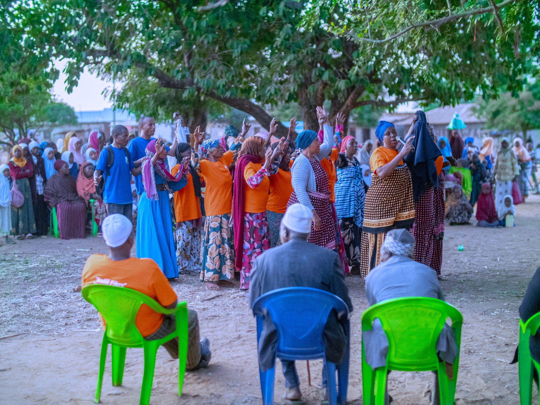 Women and men taking part in a community planning discussion